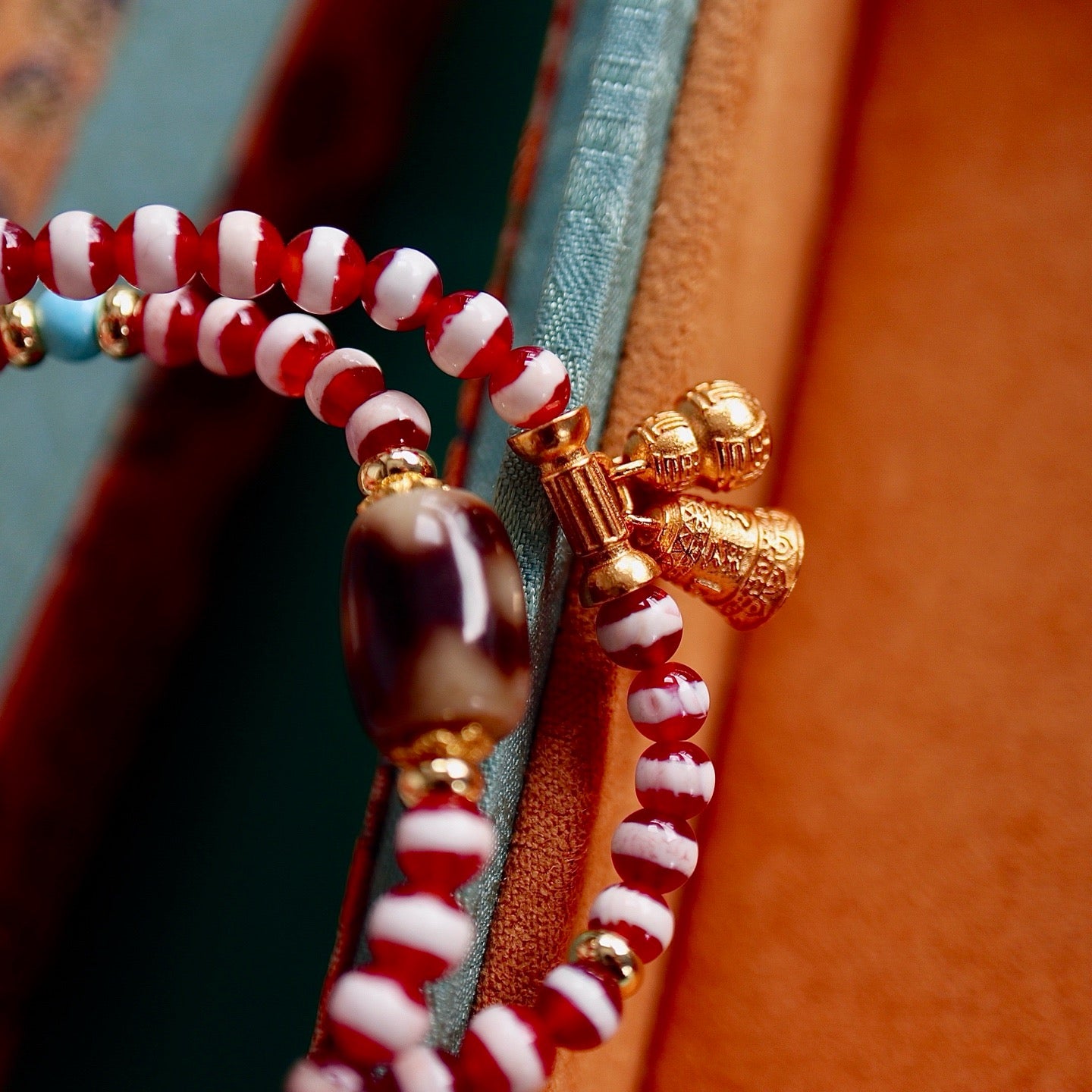 A bracelet made of natural red- meat medicine buddha dzi beads