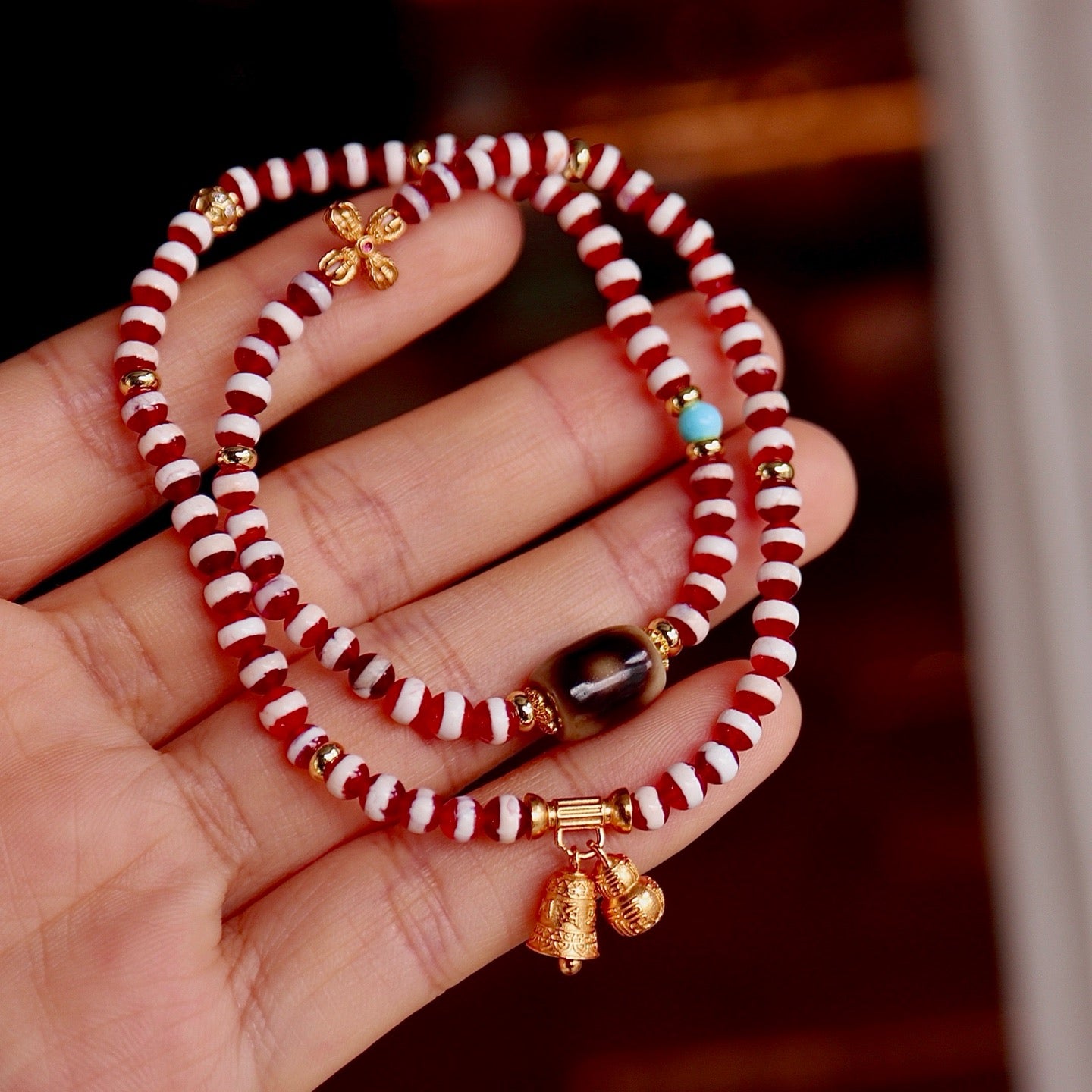 A bracelet made of natural red- meat medicine buddha dzi beads