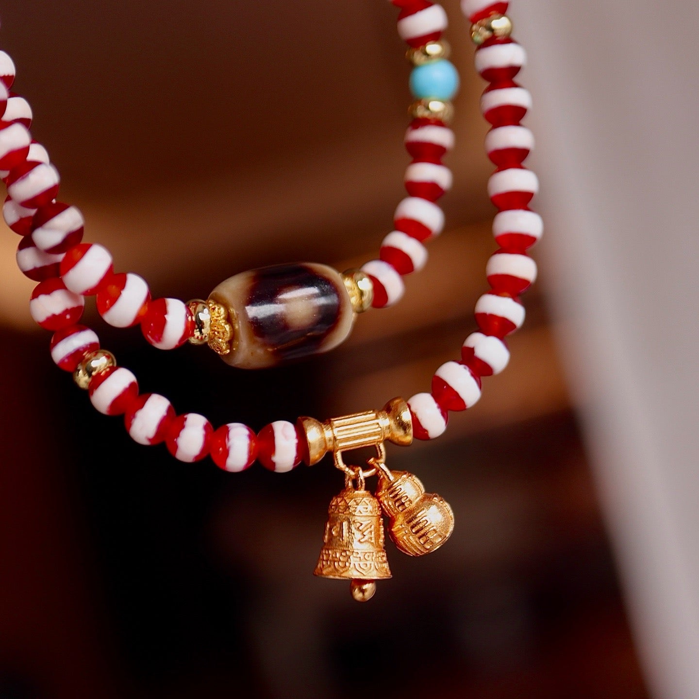 A bracelet made of natural red- meat medicine buddha dzi beads