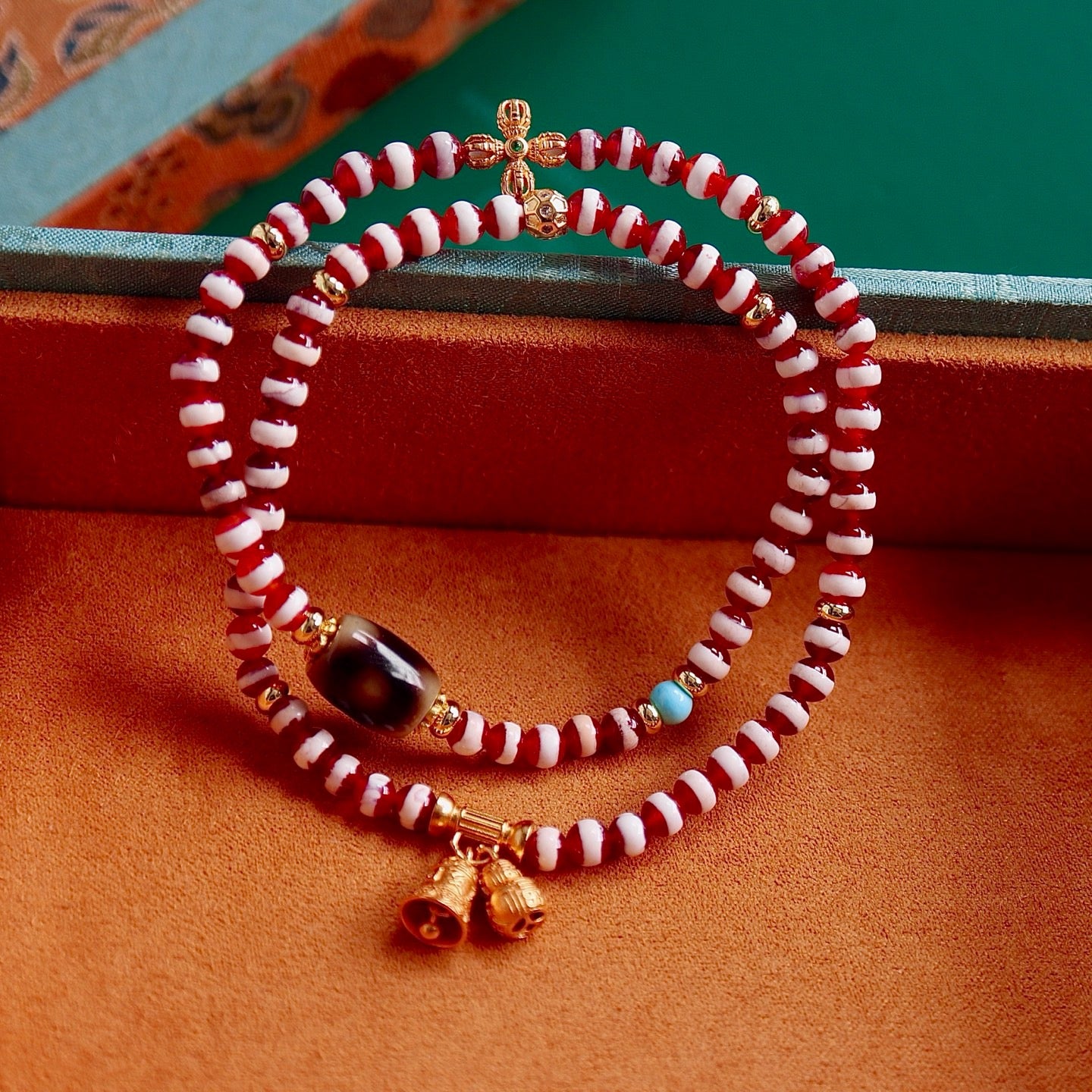 A bracelet made of natural red- meat medicine buddha dzi beads