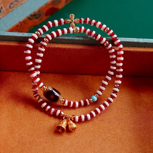A bracelet made of natural red- meat medicine buddha dzi beads