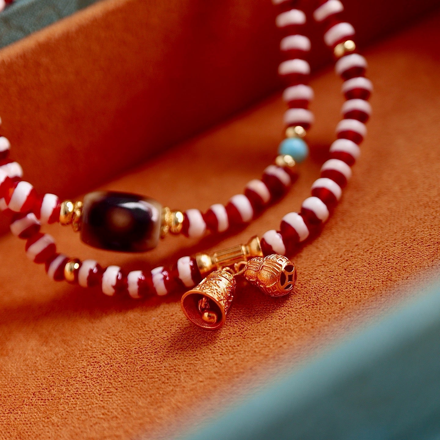 A bracelet made of natural red- meat medicine buddha dzi beads